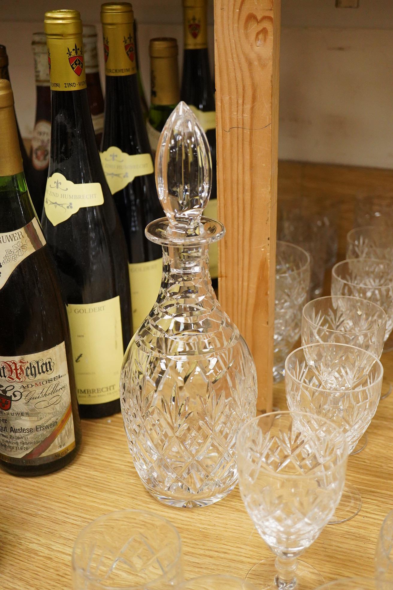 A collection of Webb cut glass suites and four decanters, together with a glass jug, largest 35cm high
